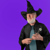 Senior man dressed for Halloween as a witch