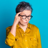 An image of a senior women considering her living arrangements.